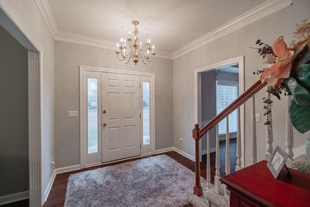 306 Amherst Dr, Tullahoma, TN 37388 - foyer entrance with stairs, wood finished floors, a chandelier, crown molding, and baseboards