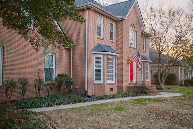 view of home's exterior with a yard