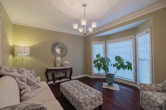 306 Amherst Dr, Tullahoma, TN 37388 - living room featuring a chandelier, baseboards, ornamental molding, and wood finished floors