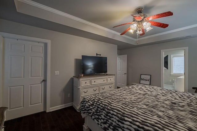 306 Amherst Dr, Tullahoma, TN 37388 - bedroom featuring dark wood-type flooring, crown molding, baseboards, a raised ceiling, and ensuite bath