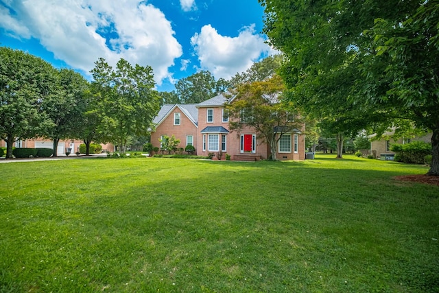 306 Amherst Dr, Tullahoma, TN 37388 - view of front of house featuring a front lawn and brick siding