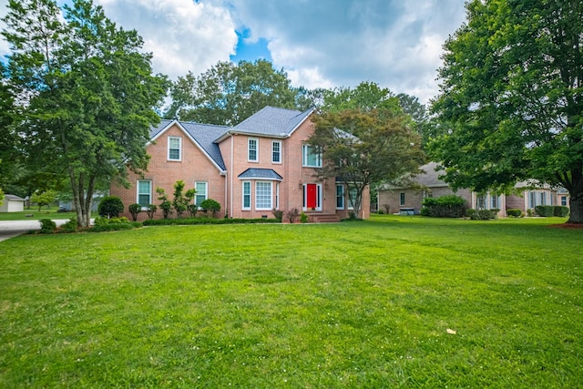 306 Amherst Dr, Tullahoma, TN 37388 - colonial house with a front lawn and brick siding