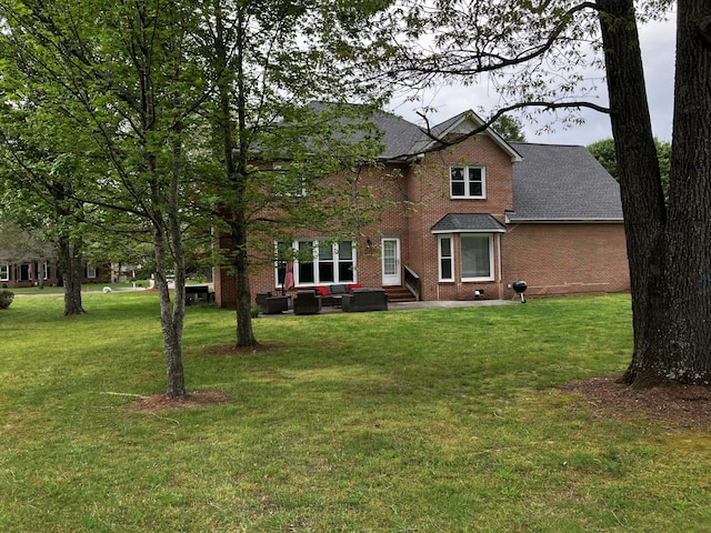 306 Amherst Dr, Tullahoma, TN 37388 - traditional-style house with an outdoor hangout area, entry steps, brick siding, and a front lawn