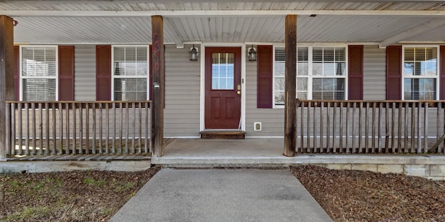 view of exterior entry with covered porch