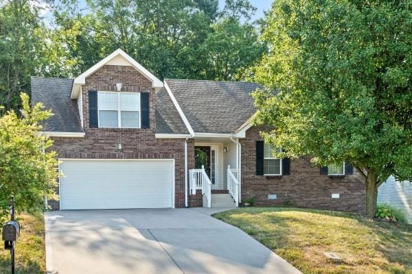 view of front of home featuring a garage and a front yard