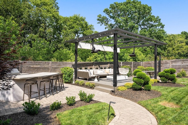 view of home's community featuring a patio, an outdoor bar, and an outdoor hangout area