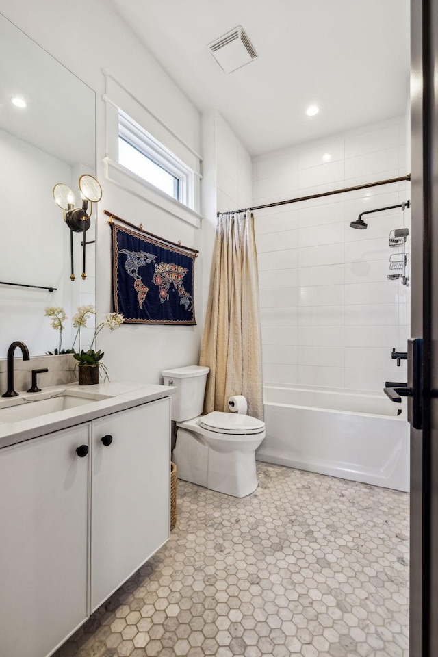 full bathroom with toilet, shower / bath combo with shower curtain, and vanity