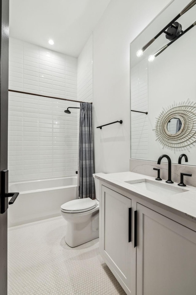 full bathroom with tile patterned floors, toilet, vanity, and shower / bathtub combination with curtain