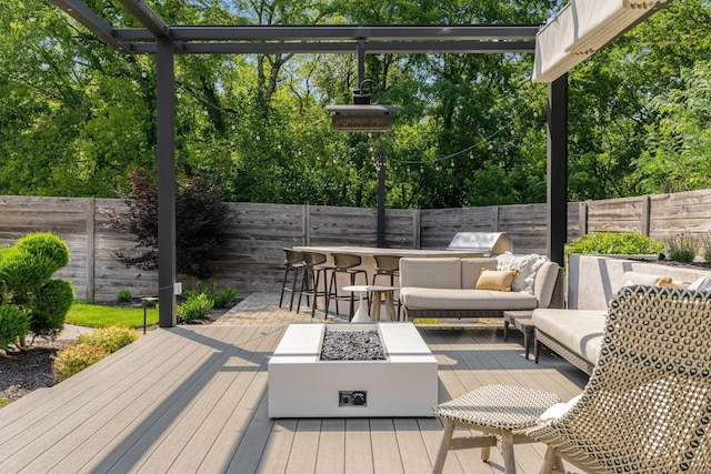 deck with an outdoor bar and an outdoor fire pit