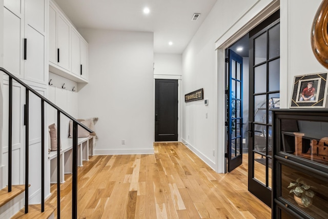 entryway with light hardwood / wood-style flooring