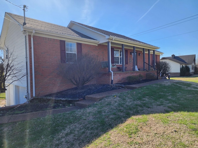 ranch-style home with a front yard and a porch