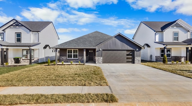 view of front of house with a garage, covered porch, and a front yard