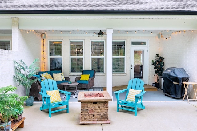 view of patio / terrace with an outdoor fire pit, grilling area, and ceiling fan