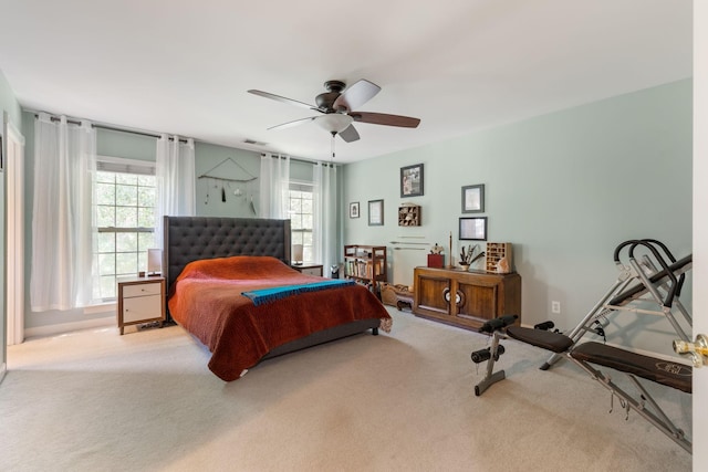 bedroom with ceiling fan and light colored carpet