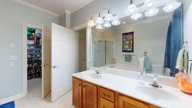 bathroom featuring toilet, a shower with door, crown molding, tile patterned floors, and vanity