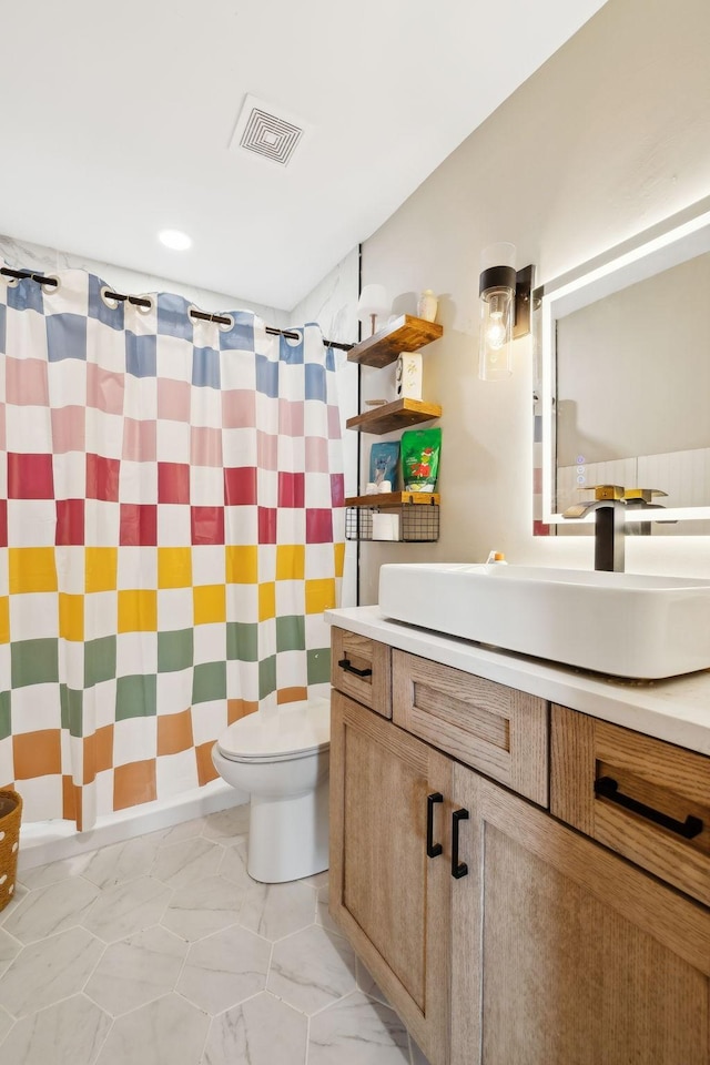 bathroom with vanity, a shower with curtain, and toilet