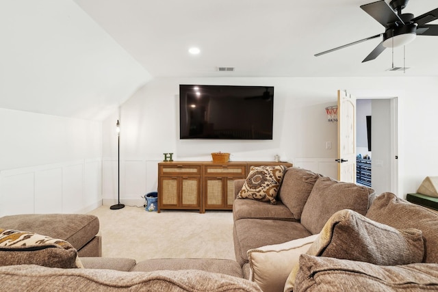 carpeted living room with vaulted ceiling and ceiling fan