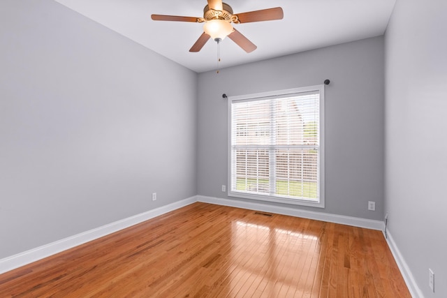 spare room featuring ceiling fan and light hardwood / wood-style floors