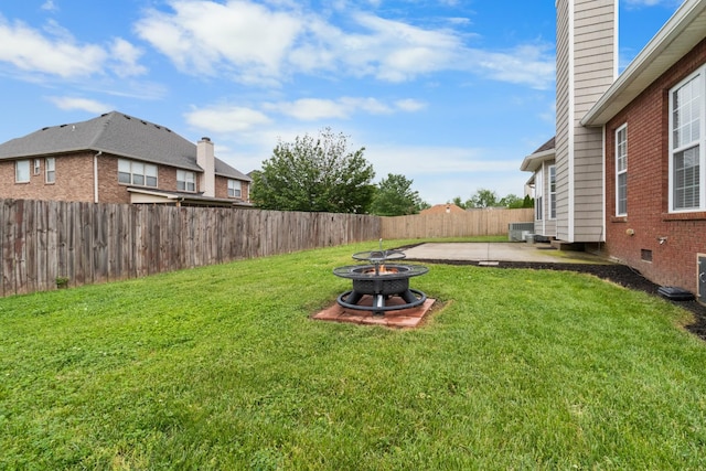 view of yard with a fire pit and a patio area