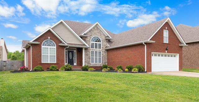 front of property with a front yard and a garage