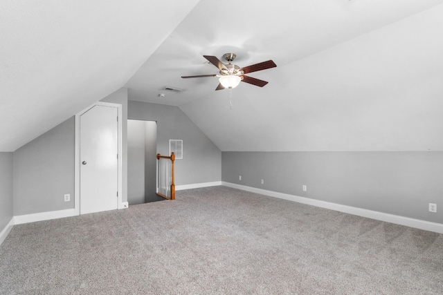 additional living space with carpet floors, vaulted ceiling, and ceiling fan