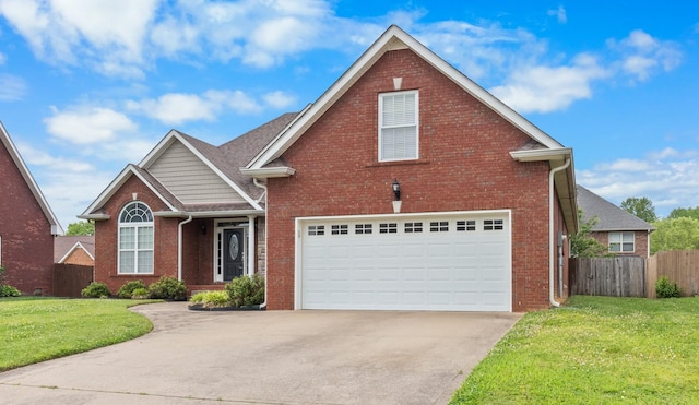 front of property featuring a front lawn and a garage