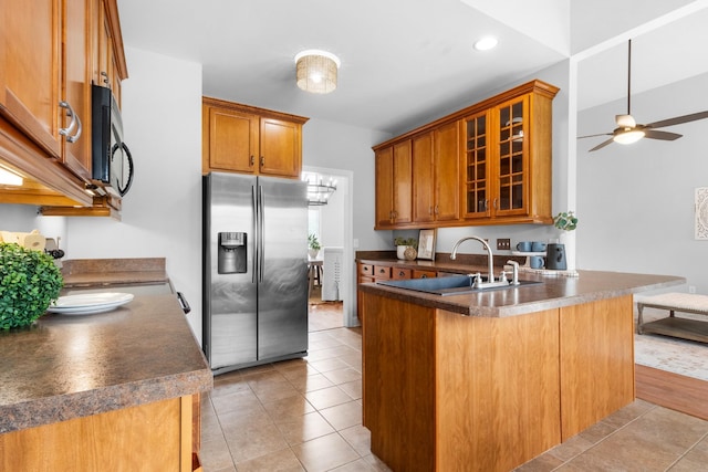 kitchen featuring kitchen peninsula, stainless steel fridge with ice dispenser, sink, ceiling fan, and light tile patterned floors