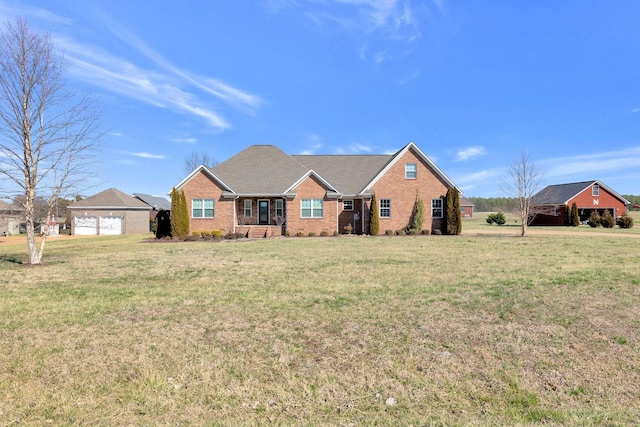 single story home with a front lawn and brick siding