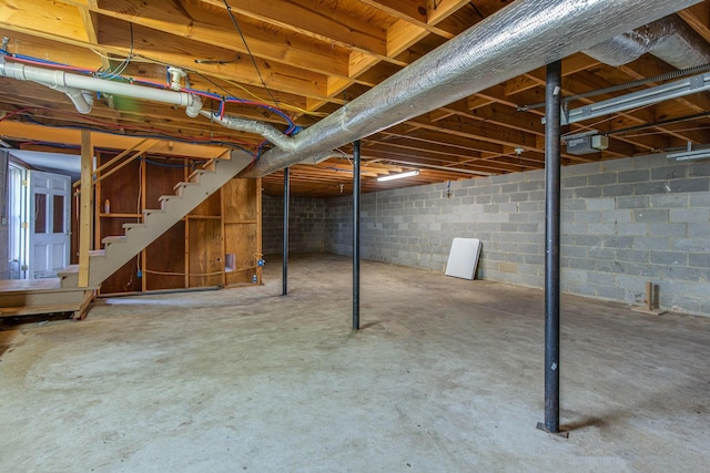 unfinished basement with stairway