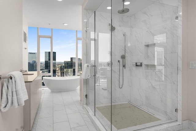 full bathroom featuring a soaking tub, a shower stall, a view of city, and marble finish floor