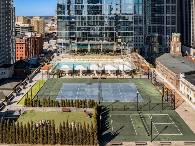 view of tennis court with fence