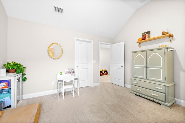 recreation room featuring light carpet and lofted ceiling