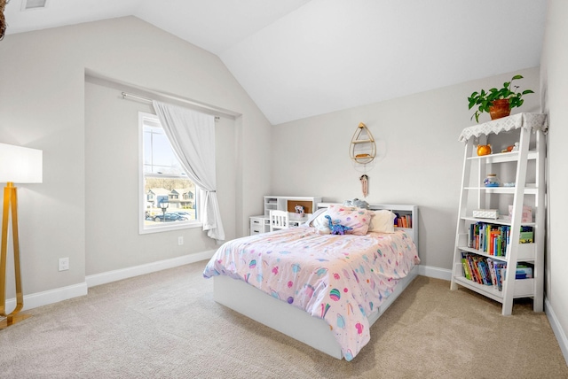 bedroom featuring vaulted ceiling and light colored carpet