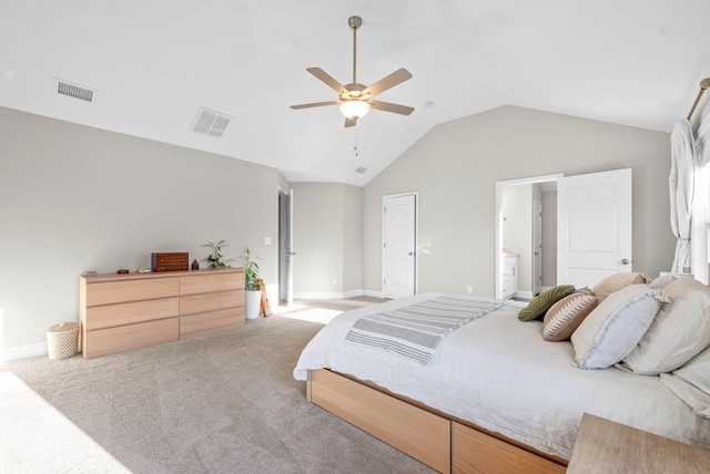 carpeted bedroom featuring connected bathroom, vaulted ceiling, and ceiling fan