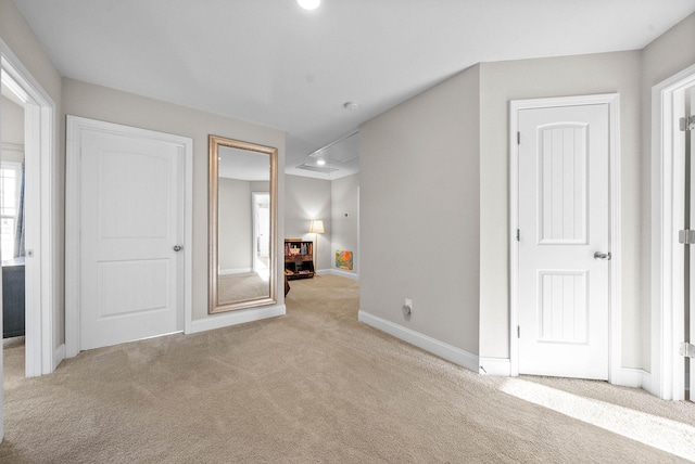 interior space featuring light colored carpet