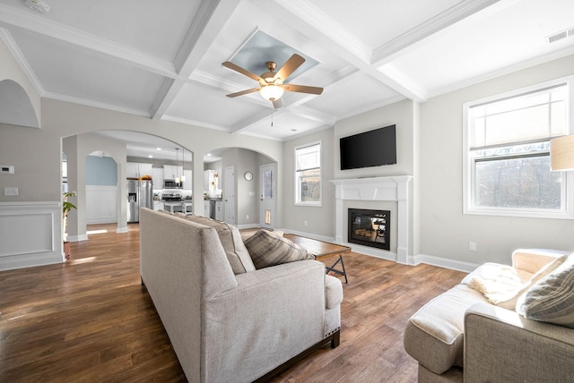 living room featuring ceiling fan, beamed ceiling, coffered ceiling, and hardwood / wood-style floors