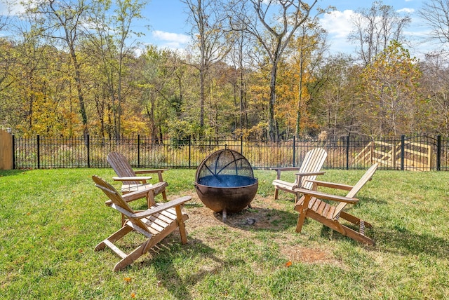 view of yard with an outdoor fire pit