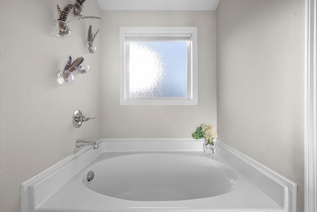 bathroom featuring a tub to relax in