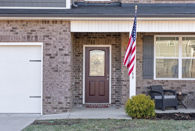 doorway to property featuring a garage