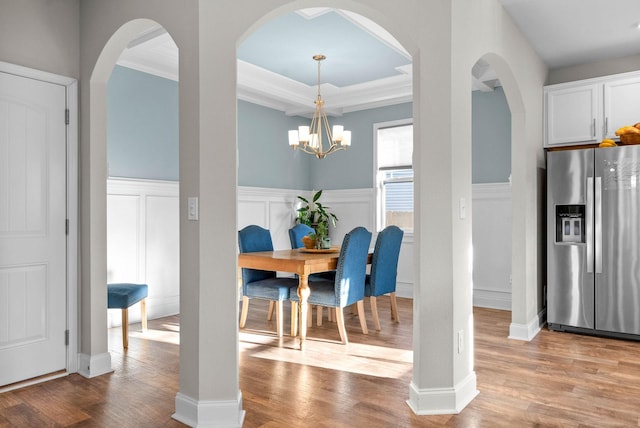 dining area featuring a chandelier and light hardwood / wood-style flooring