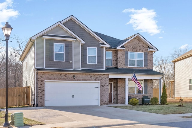 view of front of property featuring a garage and covered porch