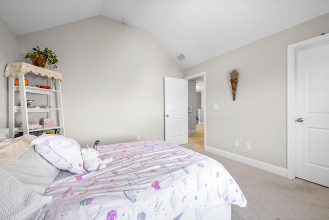 carpeted bedroom featuring vaulted ceiling