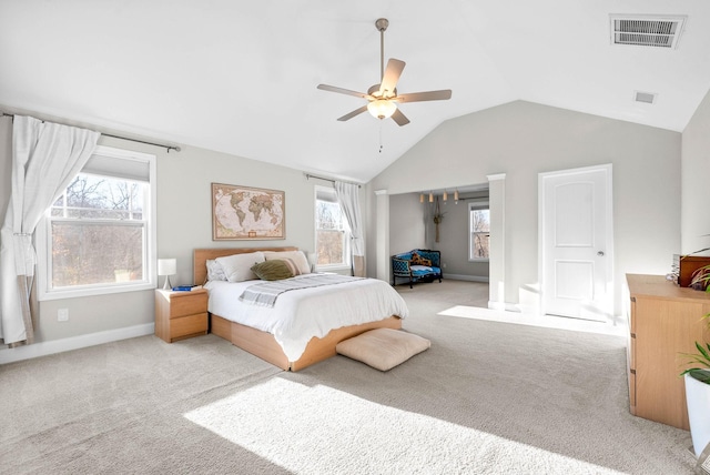 bedroom with lofted ceiling, ceiling fan, and light colored carpet