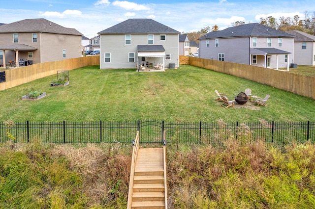 view of yard with an outdoor fire pit