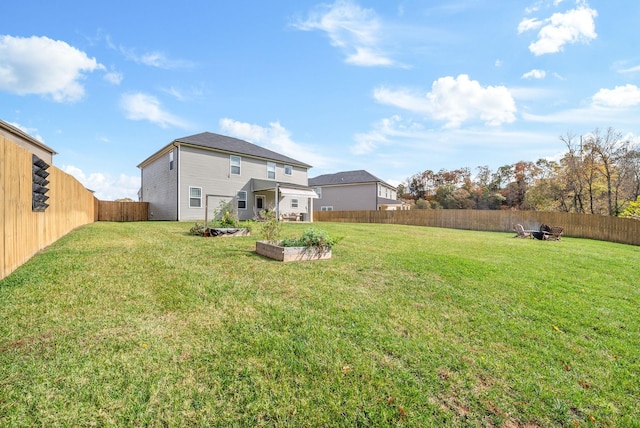 rear view of property with a yard