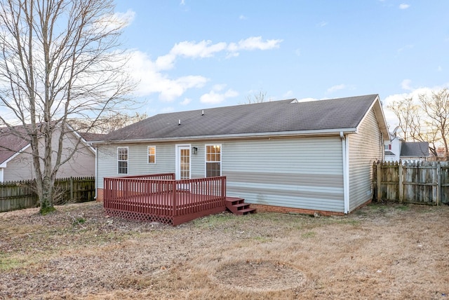 rear view of house featuring a deck