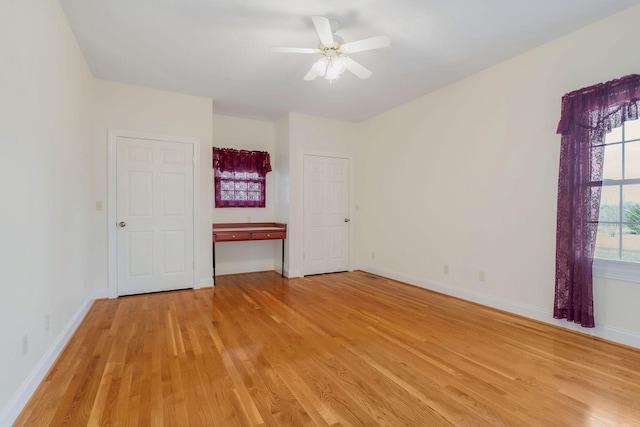 spare room with ceiling fan and light hardwood / wood-style flooring