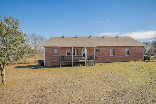 back of property featuring a yard