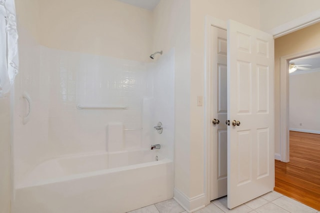 bathroom featuring tile patterned floors and  shower combination