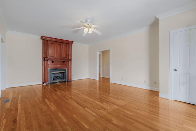 unfurnished living room with light wood-type flooring and crown molding